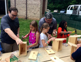 Cross and Crown Lutheran Church Men's Group help build birdhouses at Cos Kids